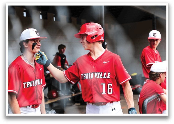 Two baseball players wearing red shirts and red hats are talking to each other. AI generated content