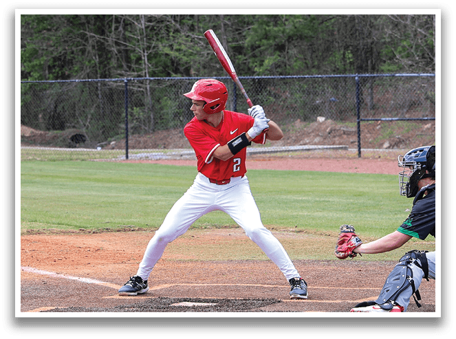 A baseball player is swinging a bat at a ball during a game. AI generated content