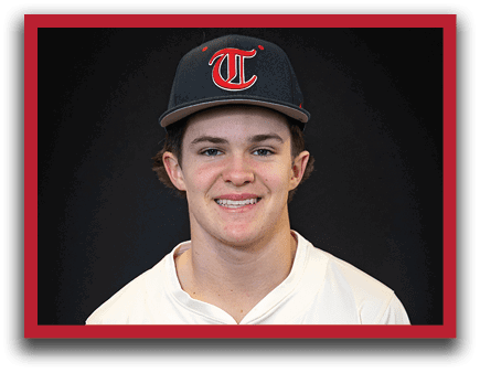 A young man wearing a baseball uniform and a black hat with the letter T on it. AI generated content