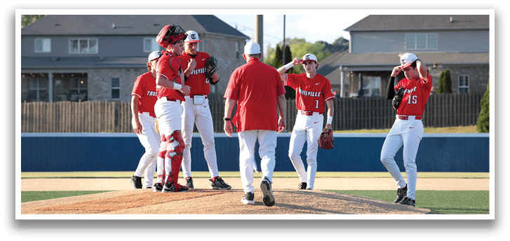 A group of baseball players on a field, some of them wearing red and white uniforms. AI generated content