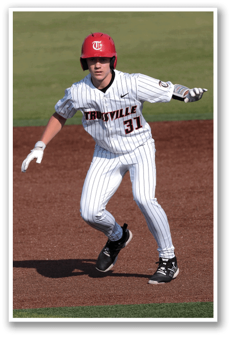 A baseball player wearing a red helmet and white uniform is running on the field. AI generated content
