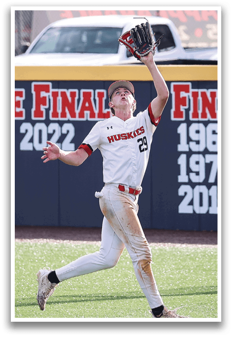A baseball player catching a ball in a baseball game. AI generated content