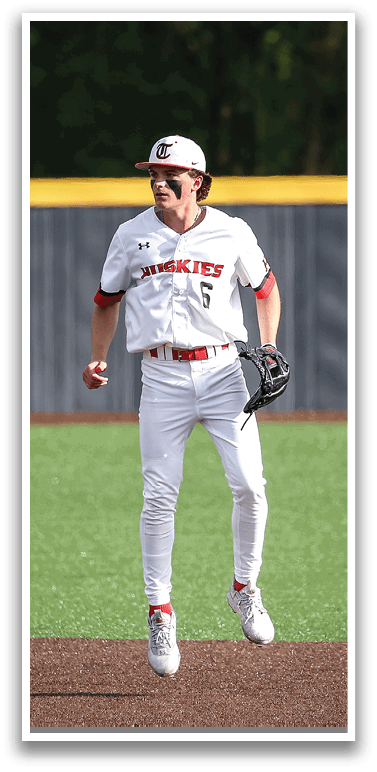 A baseball player wearing a red and white uniform is running on the field. AI generated content