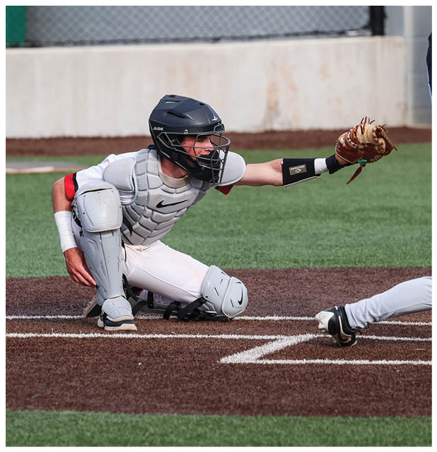 A baseball player slides into home plate during a game. AI generated content