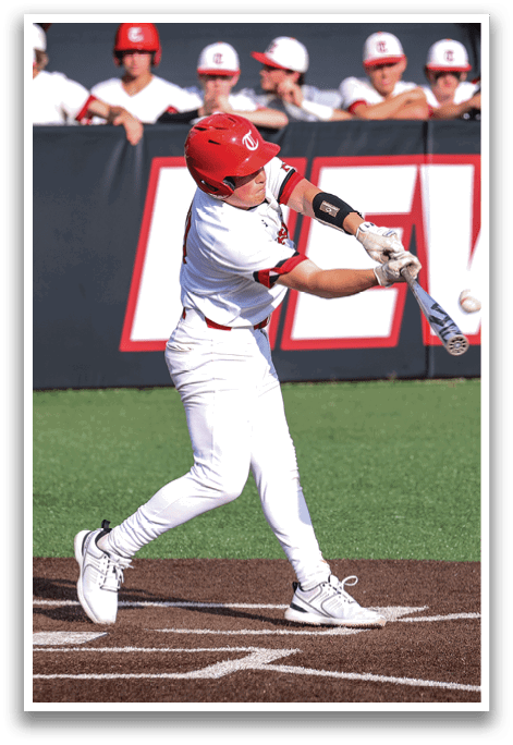 A baseball player in a white uniform is swinging a bat at a ball. AI generated content