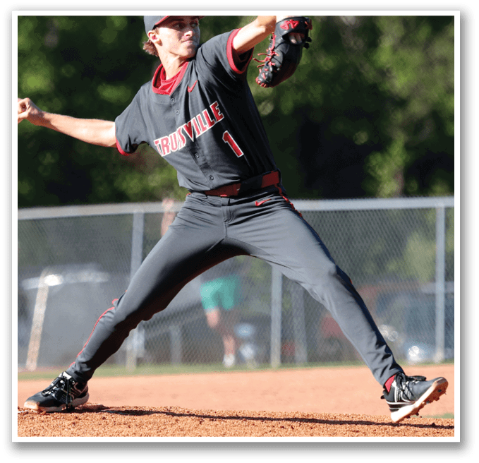 A baseball player in a black and red uniform is pitching a ball on a field. AI generated content