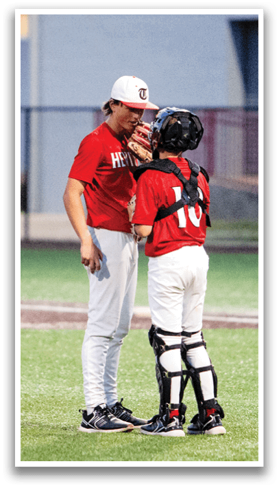 Two baseball players on a field, one wearing a red shirt and the other wearing a black shirt. AI generated content