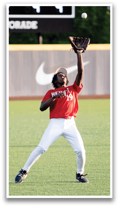 A baseball player in a red shirt and white pants is catching a ball. AI generated content