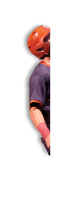 A baseball player wearing a black and red jersey stands on a field. AI generated content
