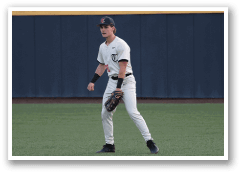 A baseball player in a white uniform is walking on the field. AI generated content