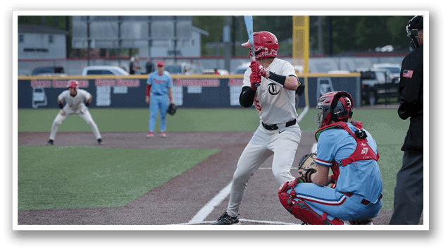 A baseball player in a blue uniform is swinging a bat at a ball. AI generated content