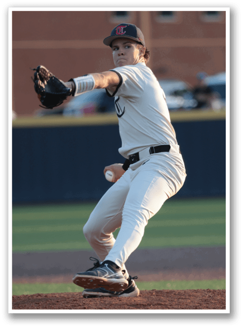 A baseball player in a white uniform is pitching a ball. AI generated content