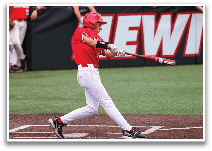 A baseball player in a red shirt and white pants is swinging a bat at a ball. AI generated content