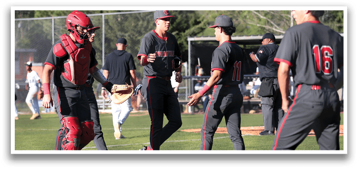 A group of baseball players on a field, some wearing red helmets and grey uniforms. AI generated content