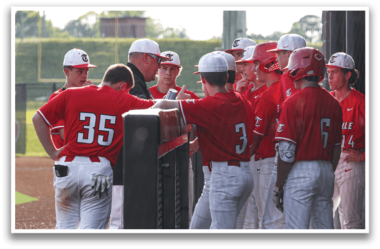 A group of baseball players wearing red jerseys are gathered around a coach, listening to his instructions. AI generated content