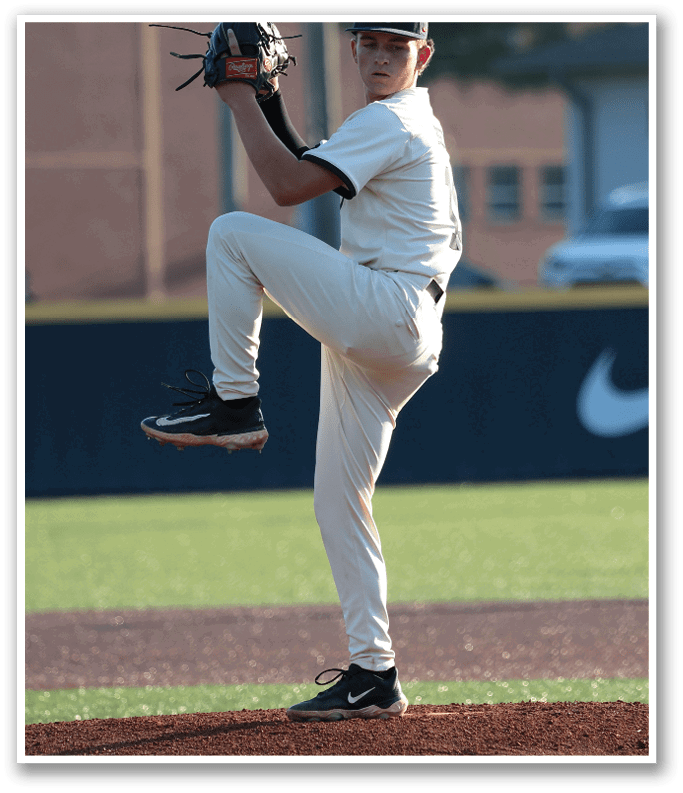 A baseball player in a white uniform is pitching a ball on a field. AI generated content