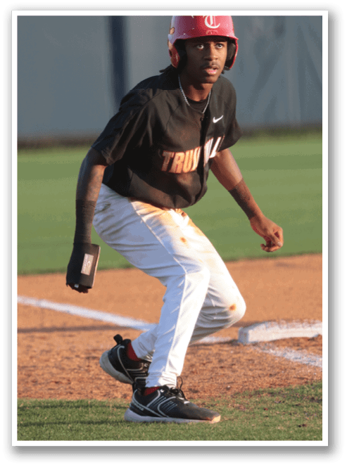 A baseball player wearing a red helmet and black shirt is running on the field. AI generated content