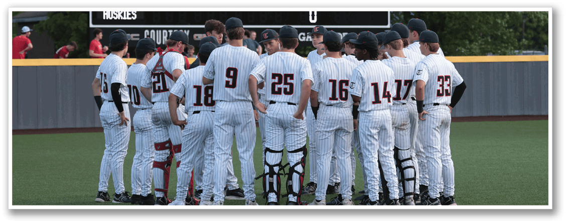 Baseball team huddled together on the field. AI generated content