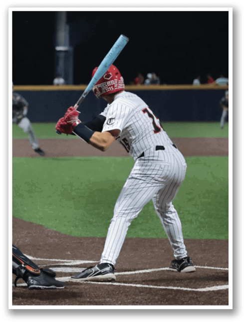 A baseball player is at bat, holding a bat and preparing to swing. The catcher is positioned behind him, wearing a baseball glove. There are several other players on the field, some of them holding baseball bats. The scene is set on a baseball field during a game. AI generated content