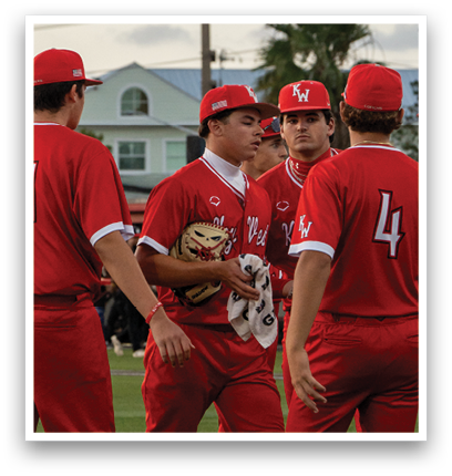 A group of men wearing red jerseys. Description generated by AI