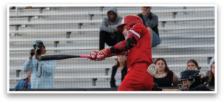 A baseball player in a red uniform is swinging a bat. Description generated by AI