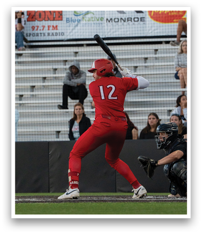 A baseball player in a red uniform is swinging a bat. Description generated by AI