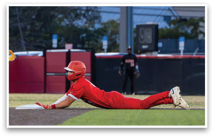 A baseball player slides into a base. Description generated by AI