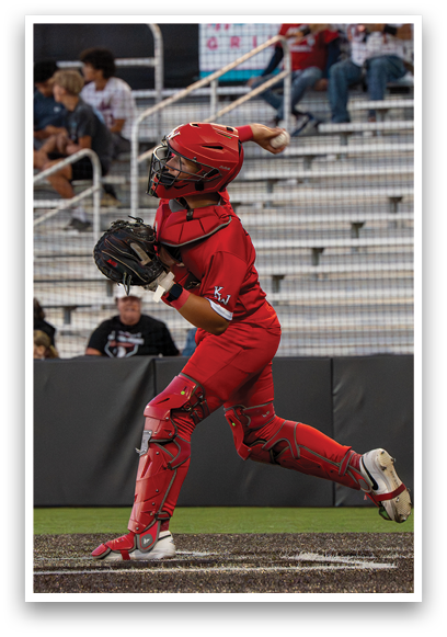 A baseball player in a red uniform is swinging a bat. Description generated by AI