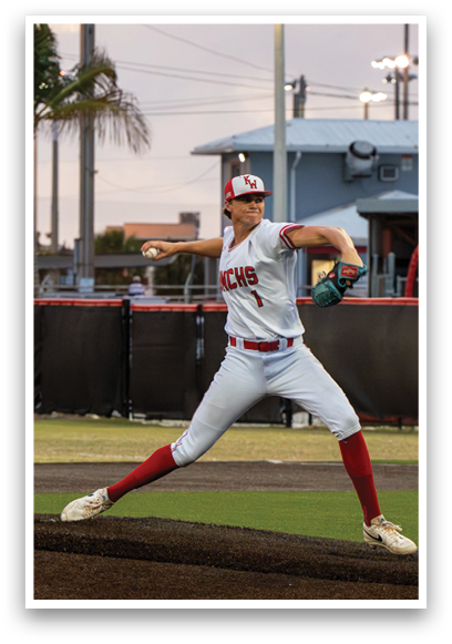 A baseball player in a white and red uniform is pitching a ball. Description generated by AI