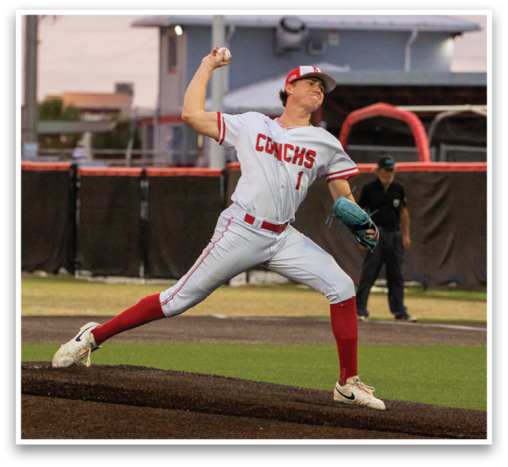 A baseball player in a red and white uniform is pitching a ball. Description generated by AI