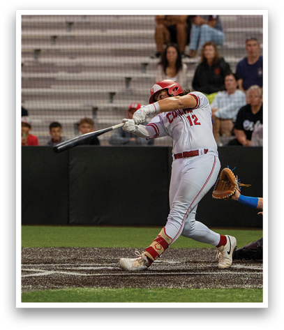 A baseball player is swinging a bat at a ball. Description generated by AI