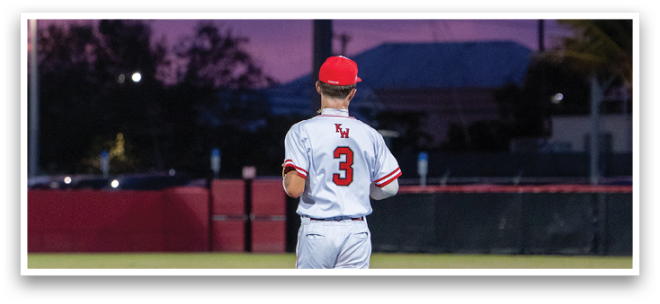 A baseball player running on a field. Description generated by AI