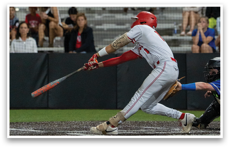 A baseball player is swinging a bat at a ball. Description generated by AI