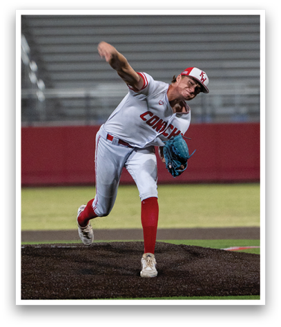 A baseball player in a white uniform is pitching a ball. Description generated by AI