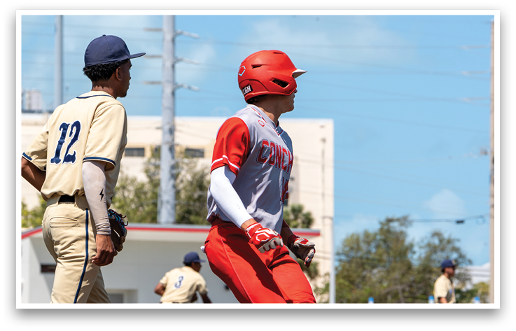 A baseball player in a red jersey is running to a base. Description generated by AI