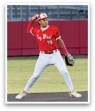 A baseball player wearing a red and white uniform. Description generated by AI