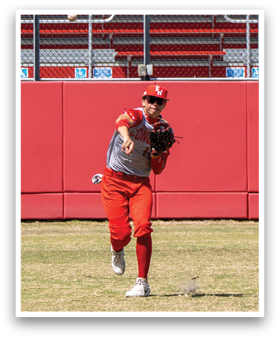 A baseball player in a red and white uniform is catching a ball. Description generated by AI