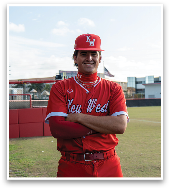 A man wearing a red baseball uniform with the letter W on the front. Description generated by AI