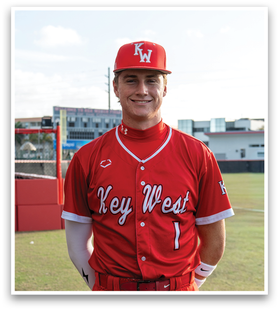 A baseball player wearing a red and white uniform. Description generated by AI