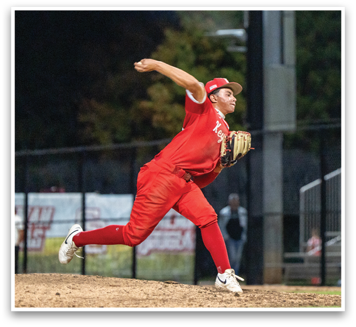 A baseball player in a red shirt and red pants is throwing a ball. Description generated by AI