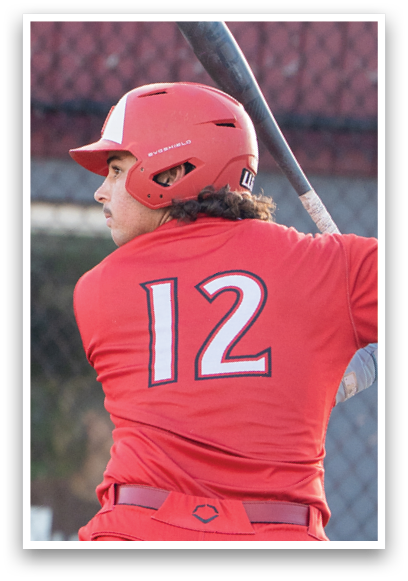 A baseball player in a red jersey is swinging a bat. Description generated by AI