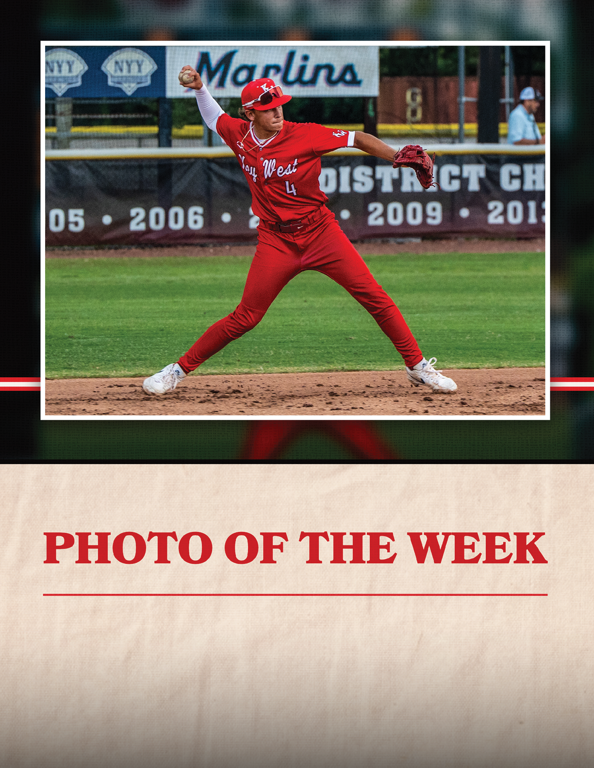 A baseball player in a red jersey and red pants is throwing a ball. Description generated by AI