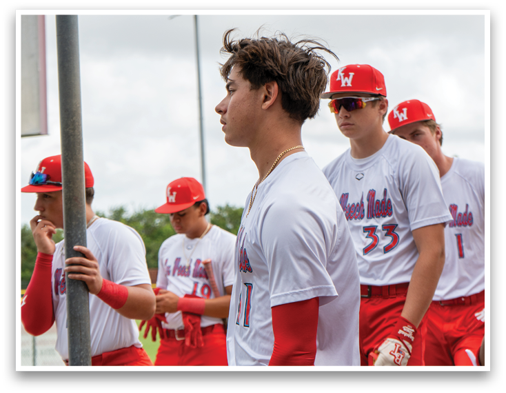 A group of young men wearing red and white uniforms. Description generated by AI