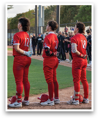 Three people wearing red shirts and red pants. Description generated by AI