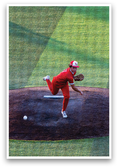 A baseball player in a red uniform is pitching a ball. Description generated by AI