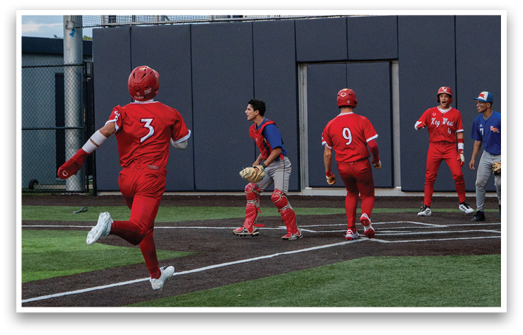 A baseball game is taking place with a group of men playing. Description generated by AI