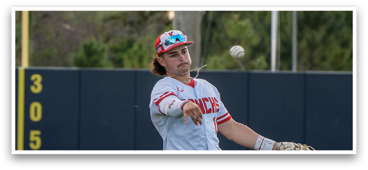 A baseball player in a white uniform is throwing a ball. Description generated by AI