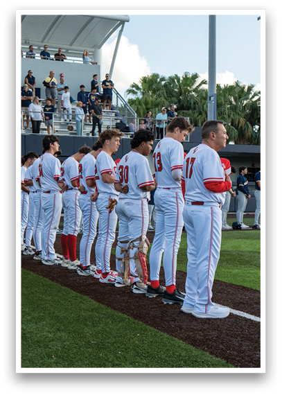 Baseball players standing on the field. Description generated by AI