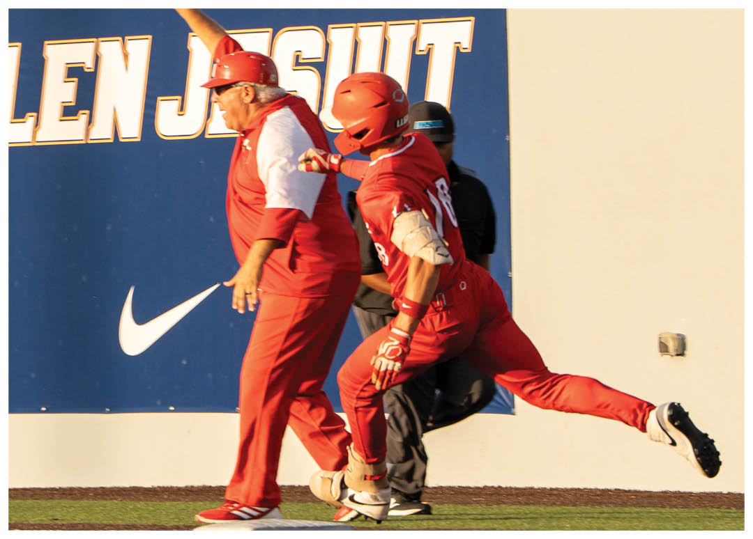 A baseball player is sliding into home plate. Description generated by AI
