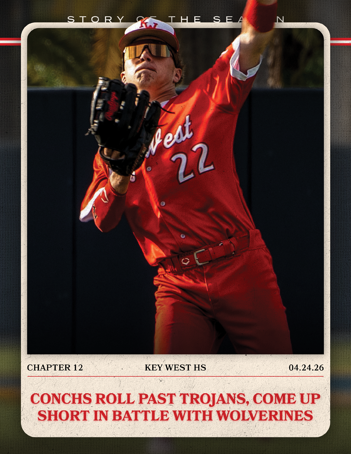 A baseball player wearing a red jersey with the number 22 on it. Description generated by AI